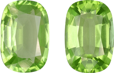 Cushion cut peridot, 10.91 by 7.54 mm, shown at actual size