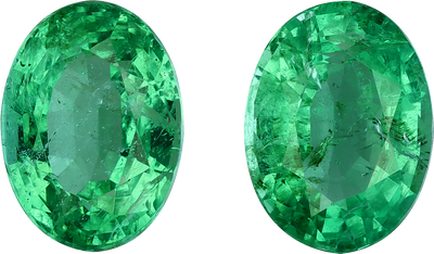 Round cut colombian emerald, 8.11 by 6.01 mm, shown at actual size