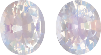 Oval cut rainbow moonstone, 11.12 by 9.56 mm, shown at actual size
