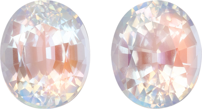 Oval cut rainbow moonstone, 11.52 by 9.46 mm, shown at actual size