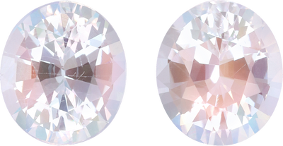 Oval cut rainbow moonstone, 8.45 by 7.34 mm, shown at actual size