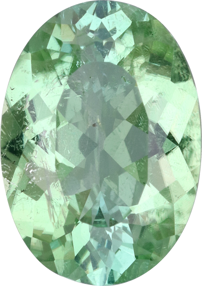 Oval cut green tourmaline, 12.93 by 9.15 mm, shown at actual size